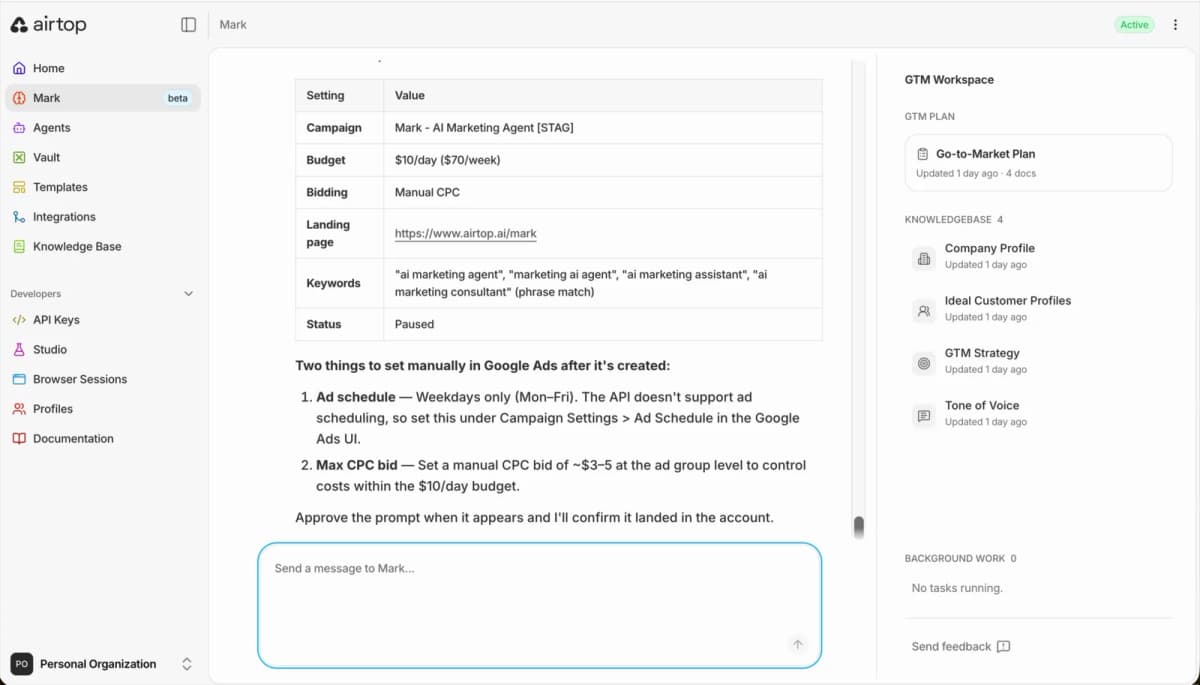 Campaign specification table showing budget, manual CPC bidding, landing page, phrase match keywords, and paused status